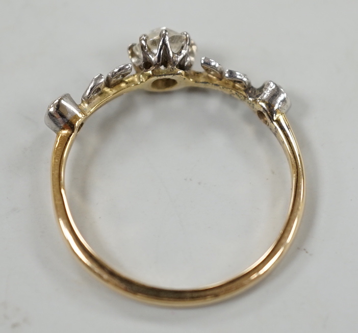 An 18ct and diamond cluster set half hoop ring, of foliate design, size N, gross weight 2.3 grams.